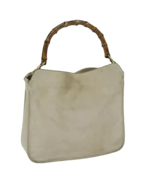 Chic Suede Shoulder Bag with Unique Bamboo Detailing